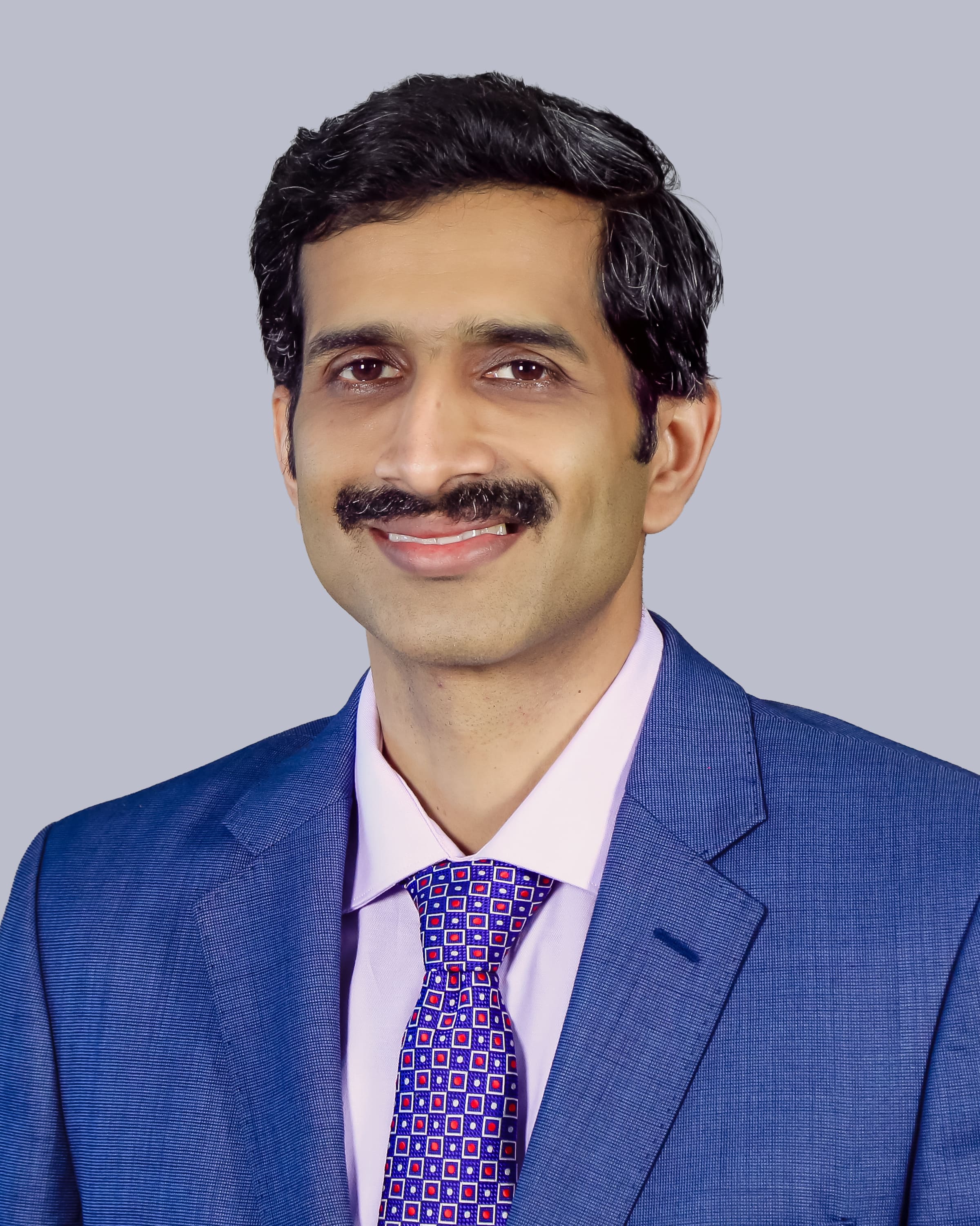 Dr. Arjun S